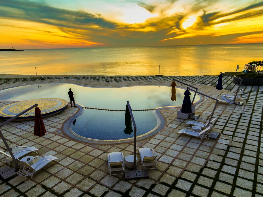 Hotel and resort pool at sunset
